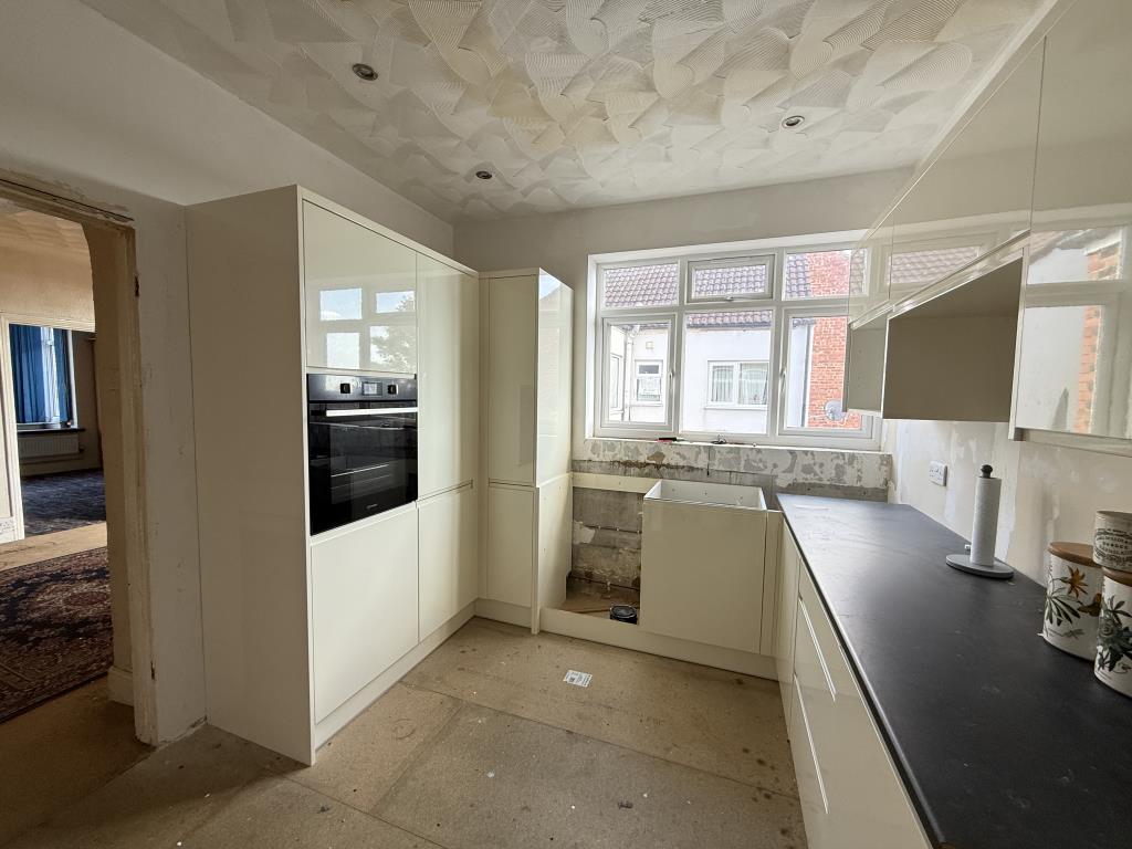 Lot: 128 - TWO-BEDROOM FLAT WITH GARAGE IN NEED OF IMPROVEMENT - Unfinished kitchen with modern fitted units